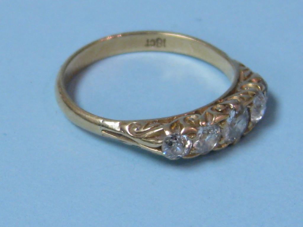 Appraisal: An ct gold five stone Diamond Ring with scroll setting