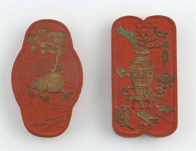 Appraisal: A Chinese red ink stone moulded with a vase containing