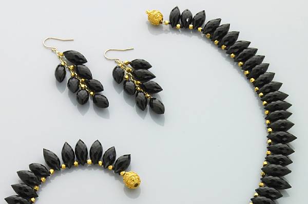 Appraisal: Suite of Black Onyx and High Karat Gold Jewelry Consisting