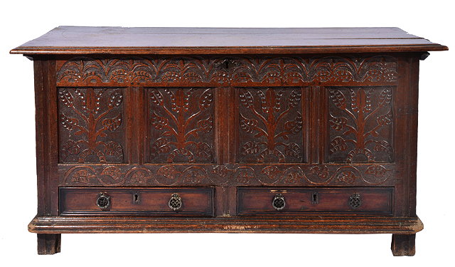 Appraisal: AN ANTIQUE OAK MULE CHEST with carved decoration to the