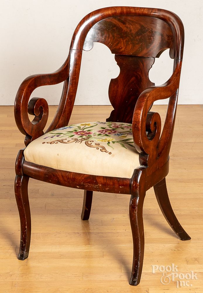 Appraisal: Classical mahogany sabre leg armchair ca Classical mahogany sabre leg