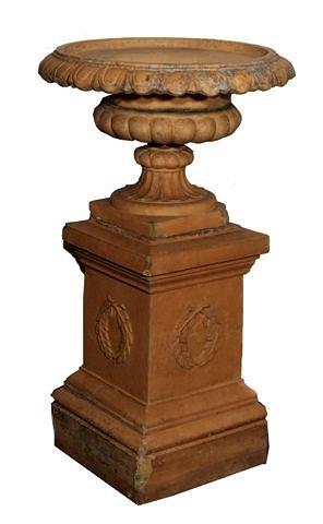 Appraisal: A VICTORIAN STONEWARE CAMPAGNA URN on a square plinth with