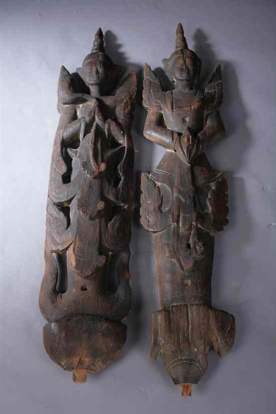 Appraisal: PAIR SOUTH EAST ASIAN WOOD FIGURES OF CELESTIAL DEITIES -