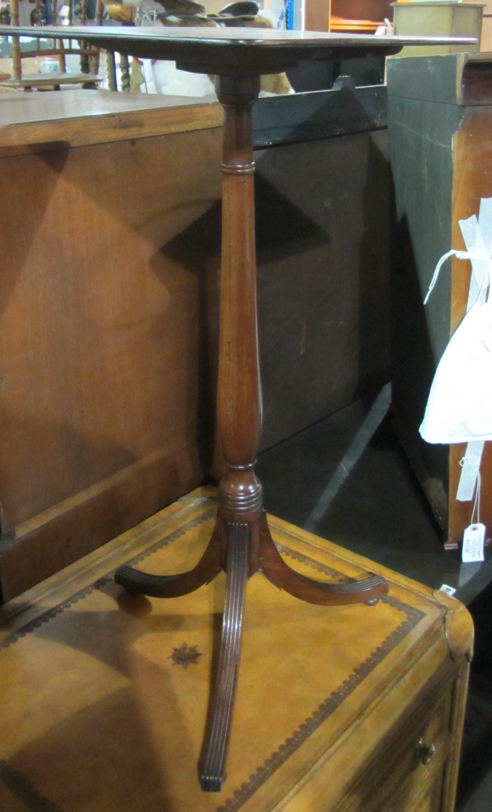 Appraisal: A th century mahogany tall tripod table with a rectangular