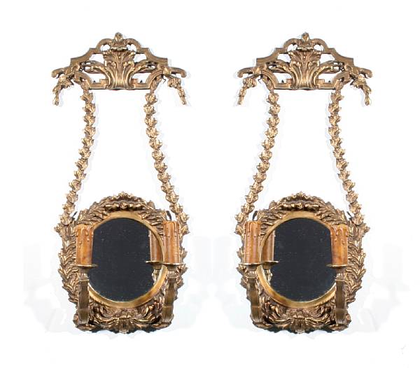 Appraisal: A pair of Louis XVI style bronze two light mirrored