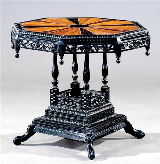 Appraisal: Aesthetic Movement carved mixed wood center table octagonal sunburst top