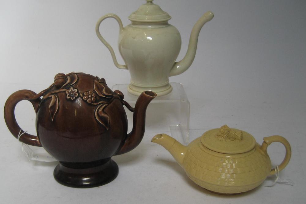 Appraisal: A MINIATURE CREAMWARE TEAPOT AND COVER late th century of