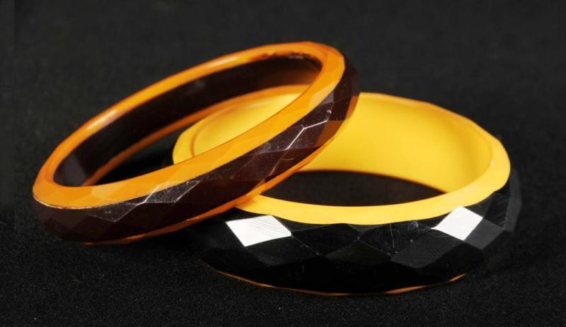 Appraisal: Pair of Laminated Bakelite Bracelets Description Black and cream and