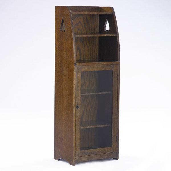 Appraisal: LIMBERT Diminutive single-door bookcase no with spade cut-outs and tapering