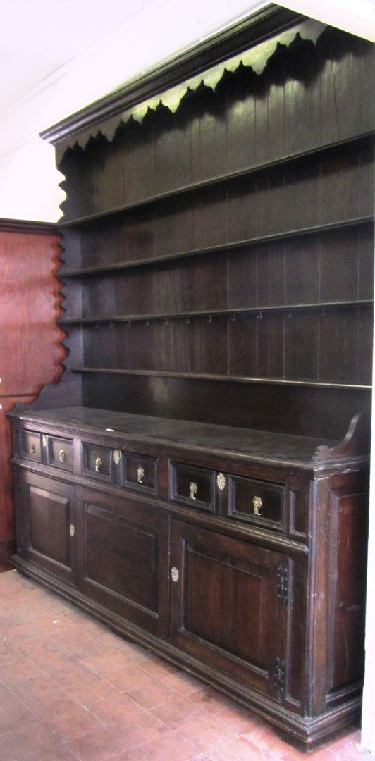 Appraisal: A large th century and later oak dresser the enclosed