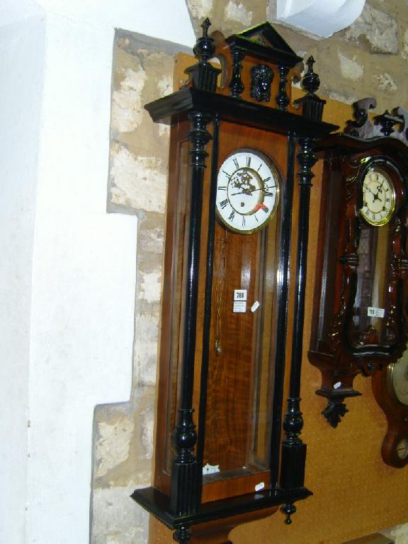 Appraisal: A Victorian walnut and black line Vienna regulator wall clock