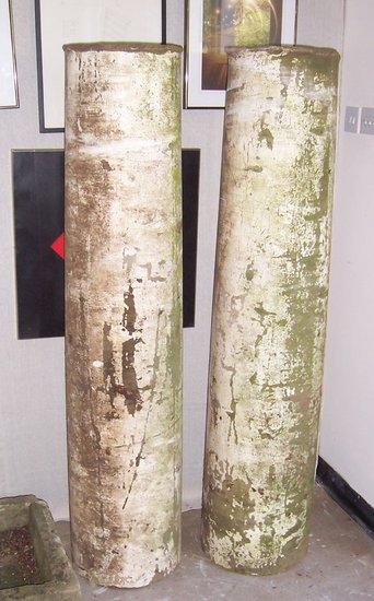 Appraisal: A pair of cylindrical stone columns cm high and the