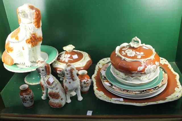 Appraisal: THREE STAFFORDSHIRE POTTERY DOGS a Derby plate and other china