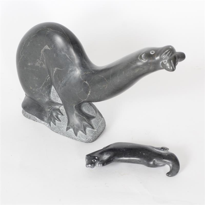 Appraisal: Two Inuit carved soapstone otter figures signed Large piece dated