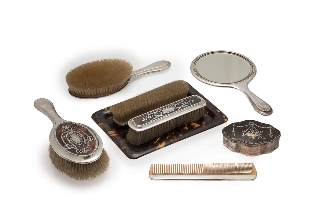 Appraisal: An Edwardian silver and tortoiseshell brush set William Comyns London