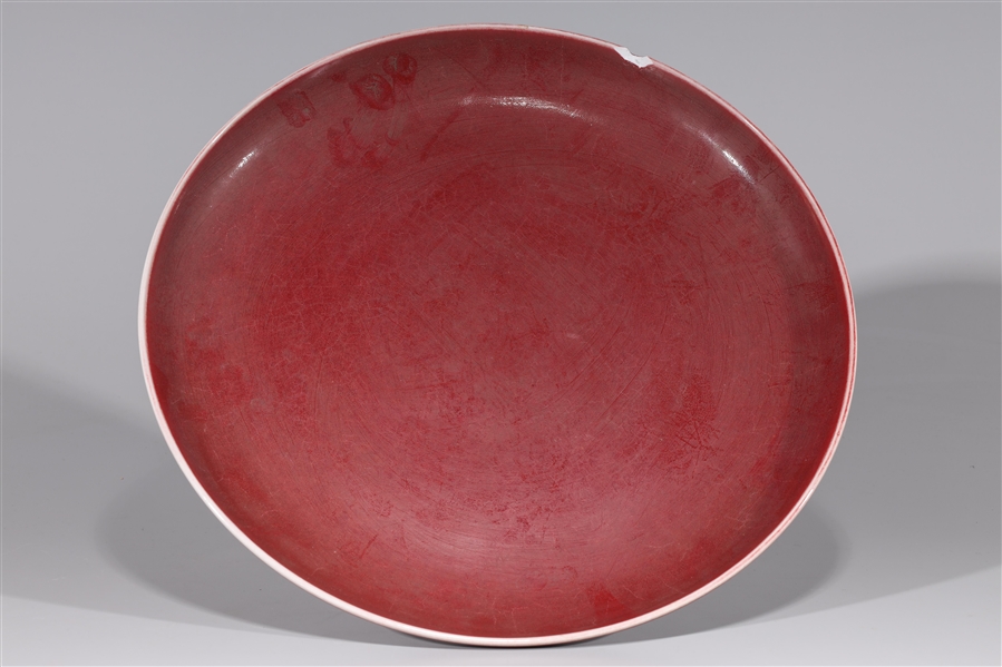 Appraisal: Chinese red glazed porcelain dish large rim chip approx heavy