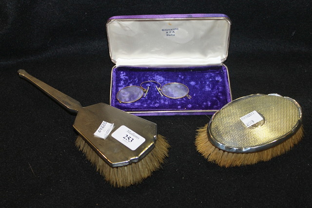 Appraisal: TWO SILVER BACKED HAIR BRUSHES with engine turned decoration together