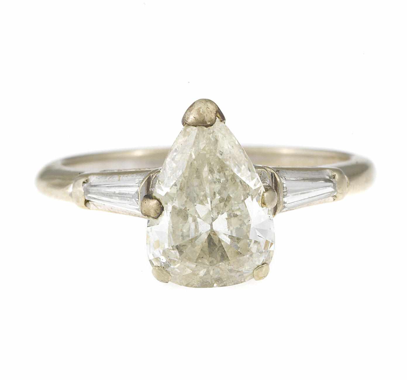 Appraisal: A diamond solitaire ring central pear-shaped diamond weighing approximately carats