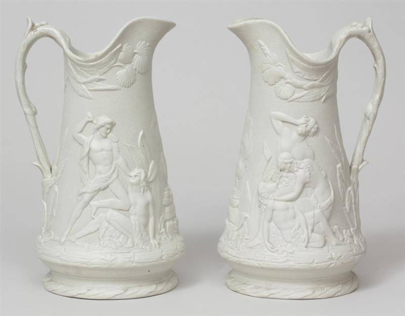 Appraisal: Pair of Staffordshire Relief-Decorated Salt Glazed Ewers Marked Edward Walley