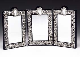 Appraisal: SILVER THREE-PANEL MIRROR Three-panel velvet-framed dressing mirror each panel with