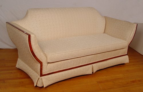 Appraisal: HOLLYWOOD REGENCY STYLE MAHOGANY FRAME SOFA White floral upholstery Measures