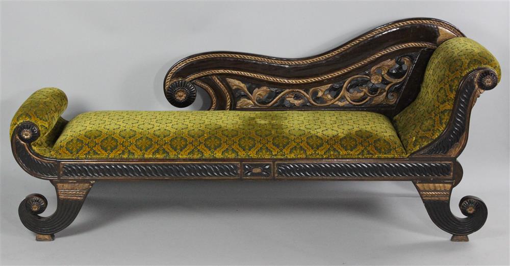 Appraisal: INDONESIAN CARVED AND GILTWOOD CHAISE the chaise with a shaped