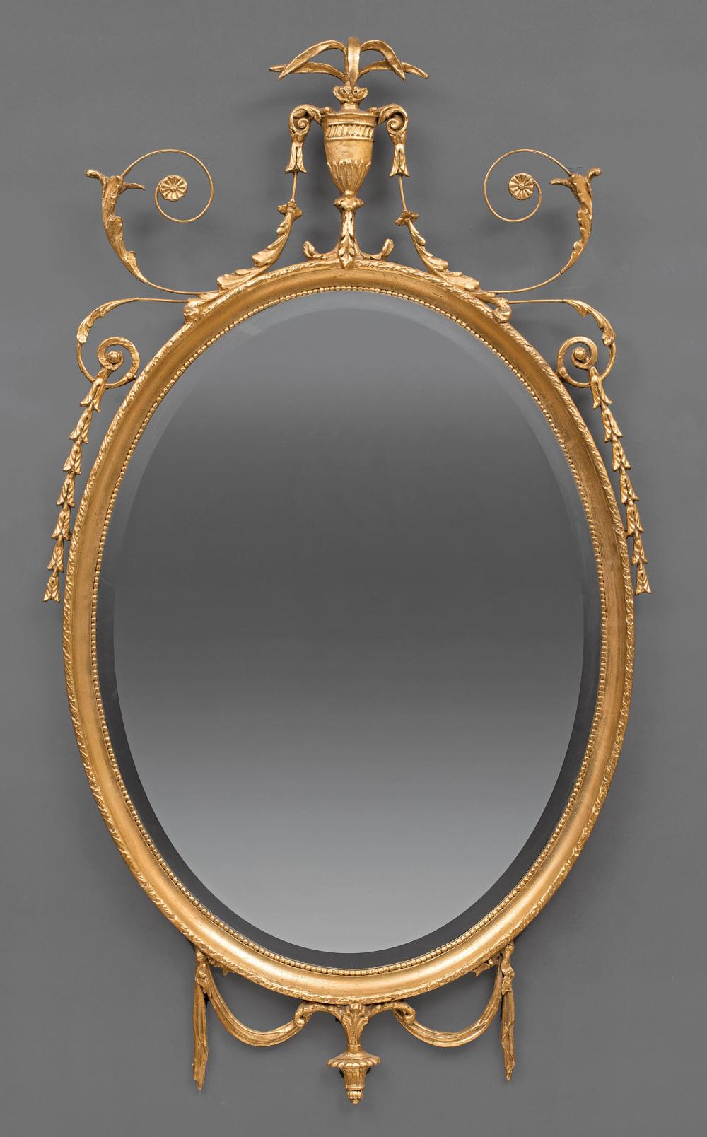 Appraisal: Louis XVI-Style Giltwood Oval Mirror swagged urn and leaf scrolled