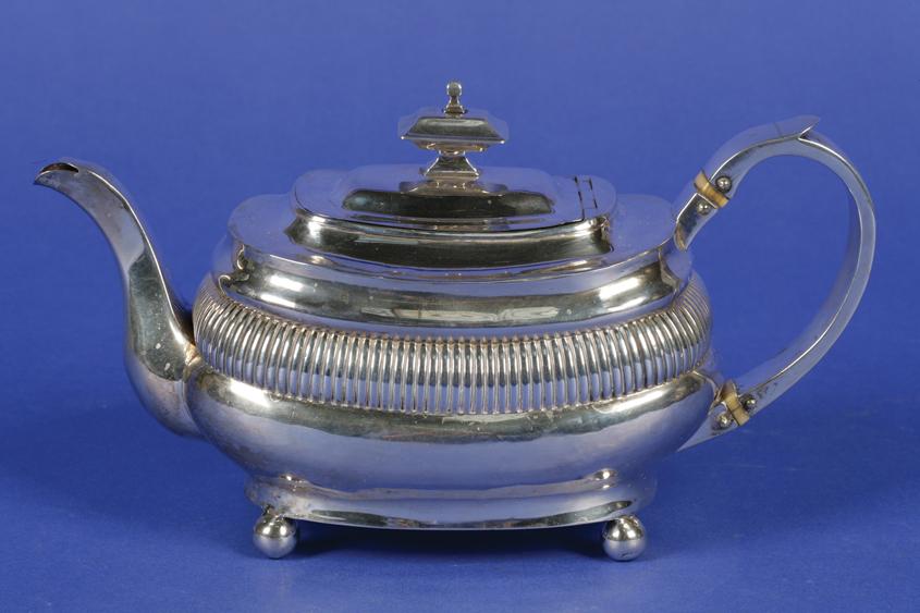 Appraisal: A GEORGE III TEAPOT of oval form with a flush