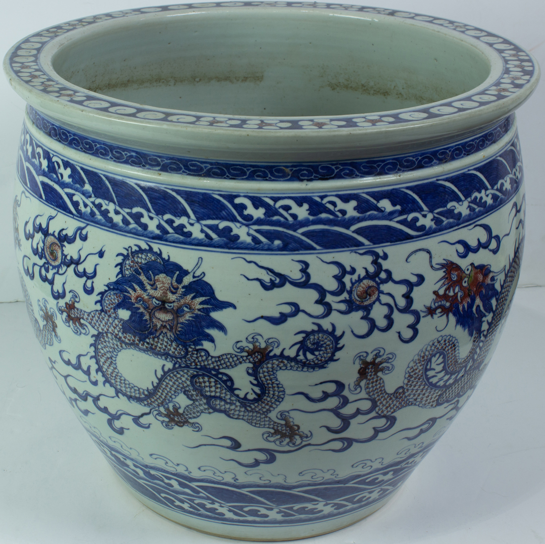 Appraisal: UNDERGLAZE BLUE AND COPPER RED FISH BOWL Underglaze blue and