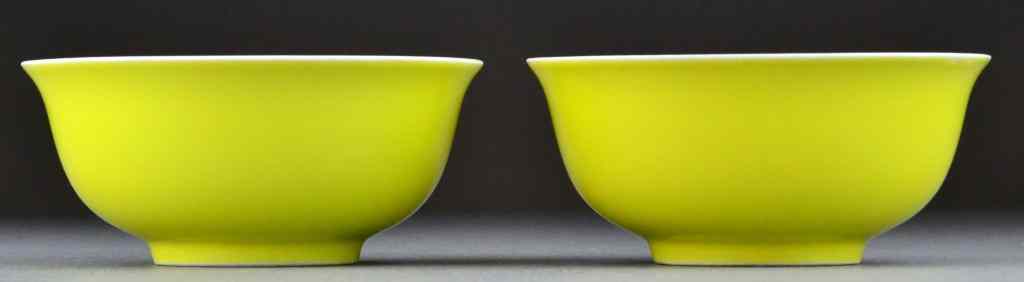 Appraisal: Pr Chinese Qing Lemon Yellow Porcelain BowlsWith slightly flared rim