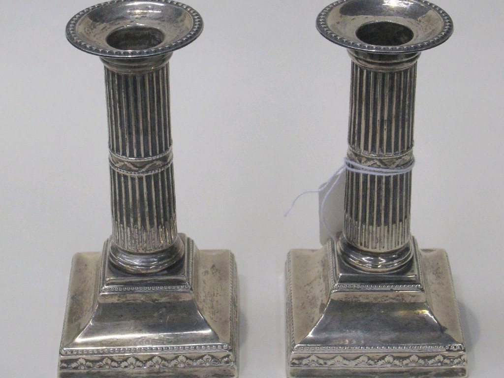 Appraisal: Pair of Victorian silver library candlesticks with reeded columns London