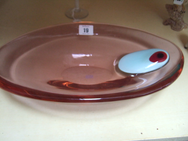 Appraisal: A modern oval glass bowl of pale amber colour with