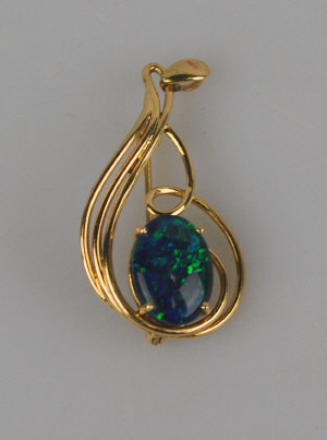 Appraisal: Opal triplet single stone pendant brooch in yellow metal mount