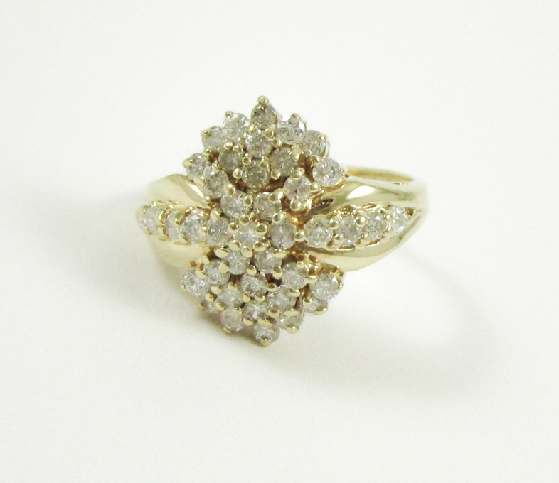 Appraisal: DIAMOND AND FOURTEEN KARAT GOLD CLUSTER RING set with round-cut