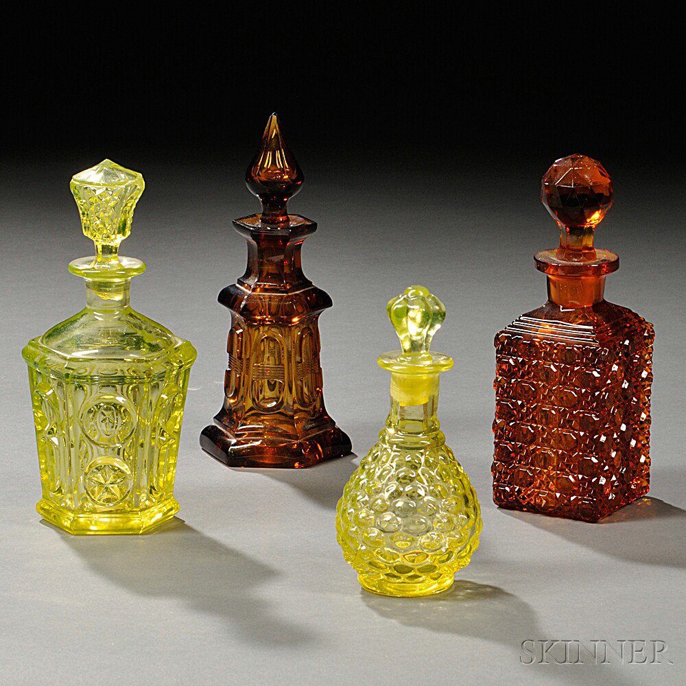 Appraisal: Four Pressed Glass Colognes probably th century Boston Sandwich Glass