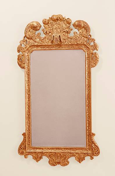 Appraisal: A pair of George II style giltwood mirrors The crest