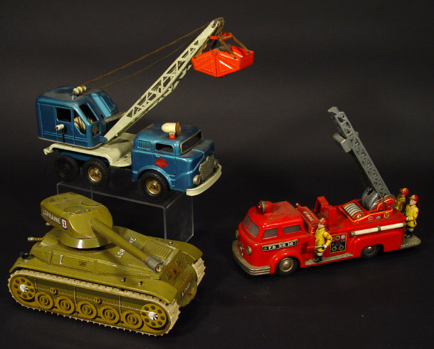 Appraisal: Three battery operated tin plate vehicles comprising a Linemar Japanese