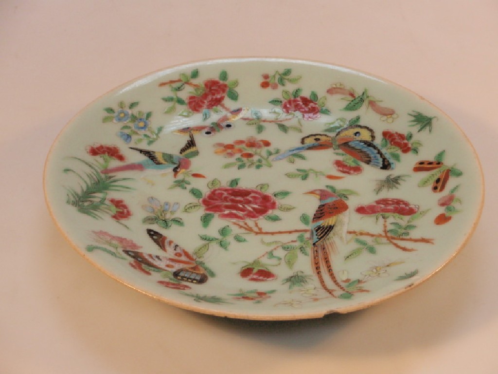 Appraisal: A thC celadon glazed Famille Rose circular plate with flowering