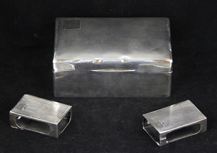 Appraisal: A silver cigarette box Walker Hall Sheffield cm wide and