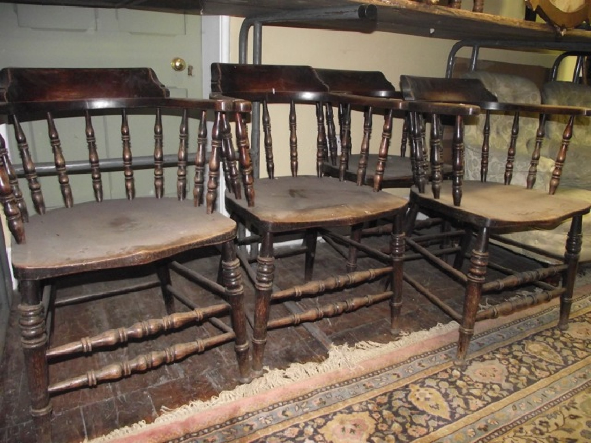 Appraisal: A set of four late th century spindleback elbow chairs