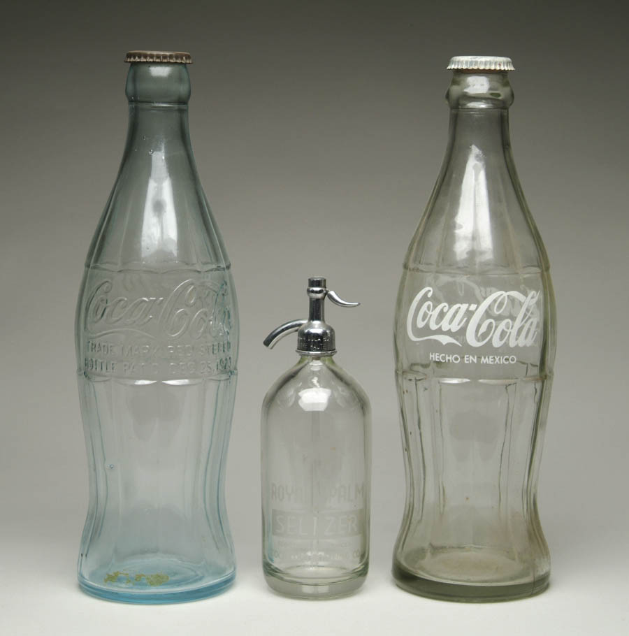 Appraisal: LOT OF COCA-COLA DISPLAY BOTTLES AND SELTZER BOTTLE Clear seltzer