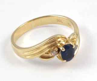 Appraisal: SAPPHIRE DIAMOND AND YELLOW GOLD RING The k gold ring