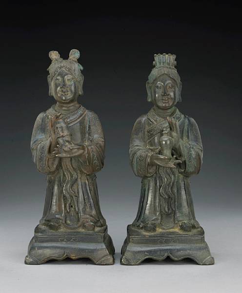 Appraisal: A pair of cast bronze female attendant figures th Century