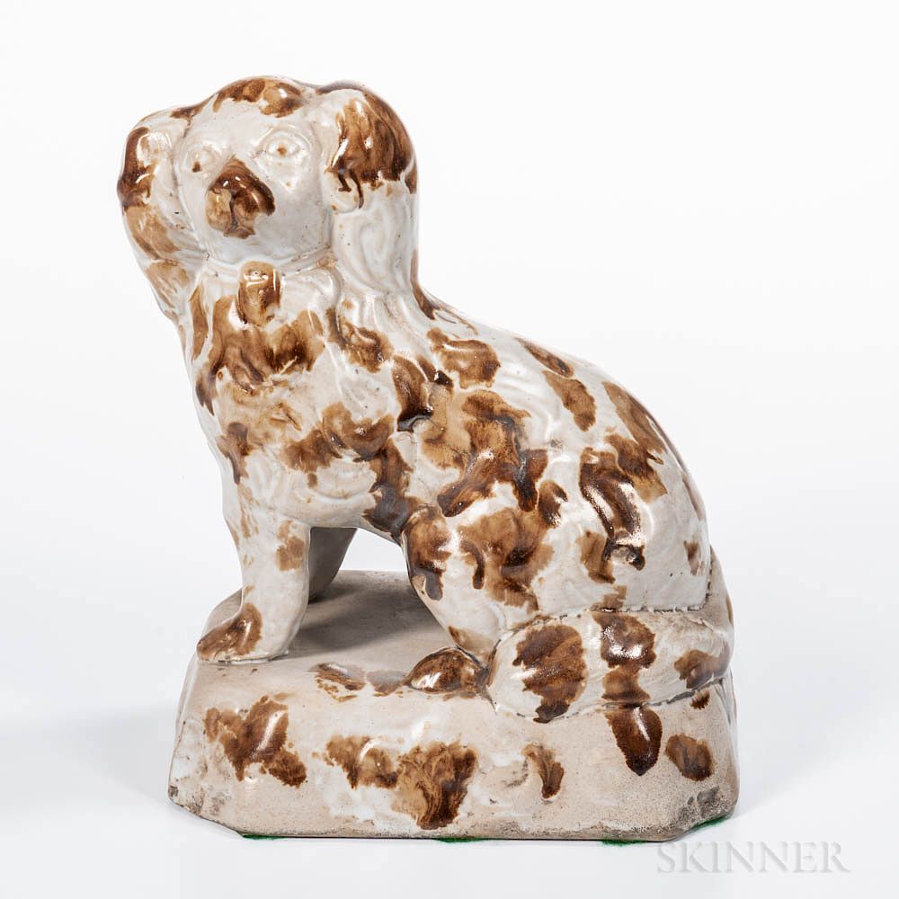 Appraisal: White and Brown Glazed Earthenware Spaniel White and Brown Glazed