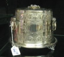 Appraisal: AN AMERICAN SILVERPLATED TEA CADDY heavily engraved with center cartouche