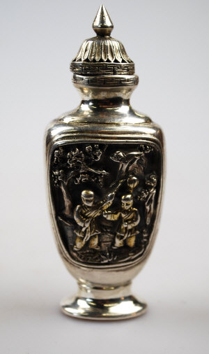 Appraisal: A Chinese style silver scent bottle relief pictorial decoration to