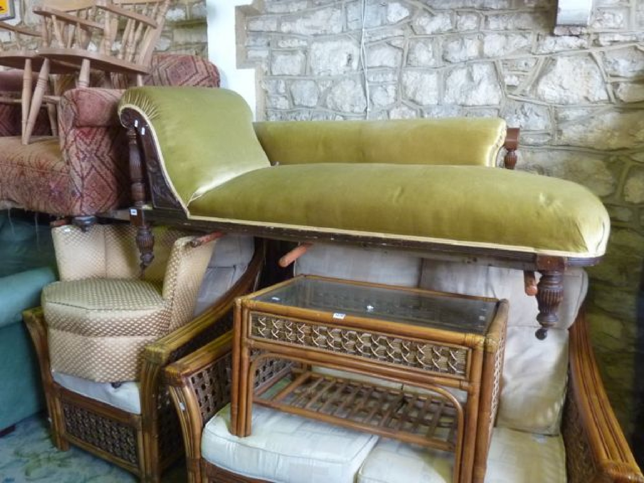 Appraisal: A late Victorian chaise lounge with upholstered seat rolled head