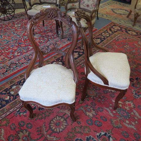 Appraisal: Pair of th Century Chairs carved fruit balloon back circa