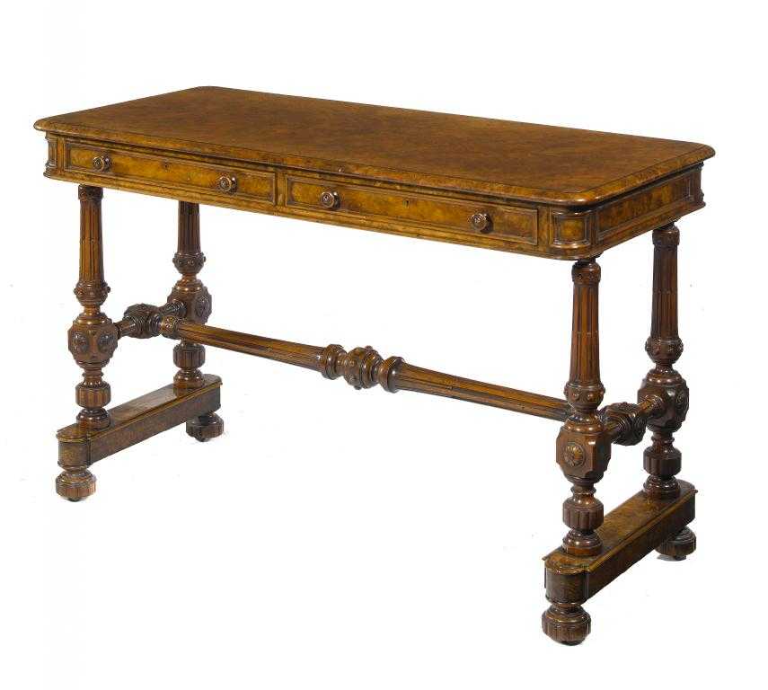 Appraisal: A VICTORIAN WALNUT TABLE the richly figured and quarter veneered