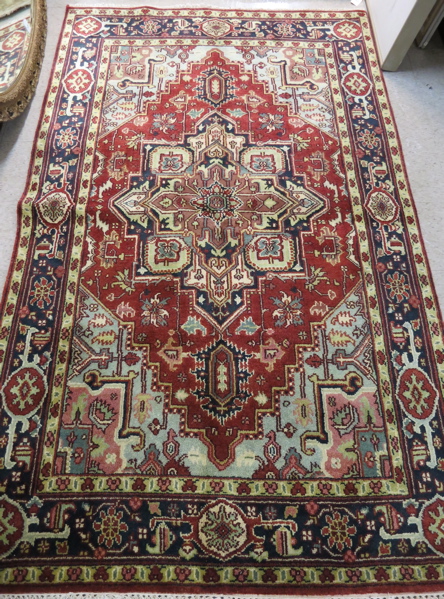 Appraisal: HAND KNOTTED ORIENTAL CARPET Persian Serapi design central geometric medallion